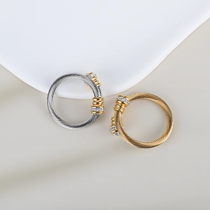 Macro detail of twisted cable ring in gold and silver with sparkling diamond accents
