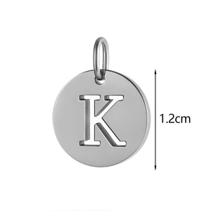 Detailed view of a 1.2cm silver stainless steel round pendant with engraved letter K