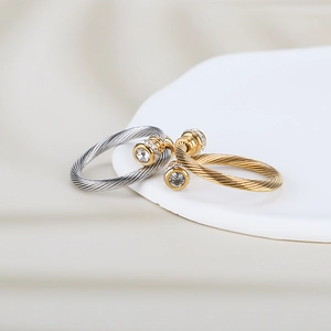 Twisted cable titanium steel rings in gold and silver finish with large round crystals