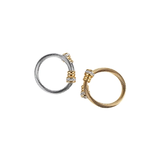 Twisted cable titanium steel ring in gold and silver finish with crystal inlay accents