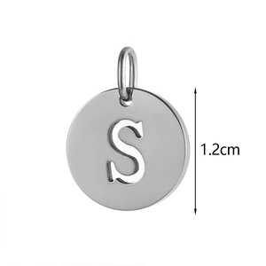 Close-up of 1.2cm silver stainless steel round pendant with engraved letter S and bail