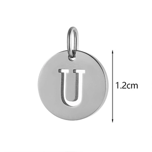 Macro view of a 1.2cm polished stainless steel round charm with hollow letter U detail