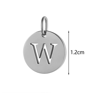 Macro shot of 1.2cm silver stainless steel round pendant with hollow letter W