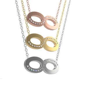 Detailed close-up of infinity pendant necklaces with sparkling crystals in three colors