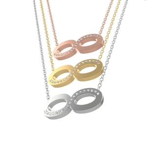 Infinity pendant necklaces in gold, rose gold, and silver finishes with crystal stones