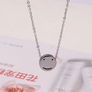 Minimalist silver smiley face pendant necklace with round disc and matching chain link