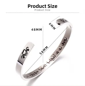 Size diagram of C-shaped stainless steel cuff with heart engraving and 58mm inner diameter