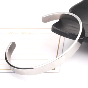 Minimalist silver polished stainless steel C-shaped cuff bracelet with adjustable design
