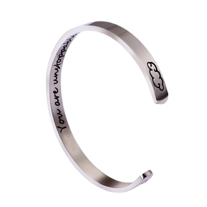 Polished C-shape stainless steel inspirational cuff with You Are Unstoppable engraving