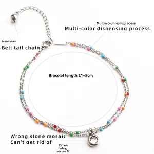 Detail of double-layer silver anklet with colorful beads, zircon charm and lobster clasp