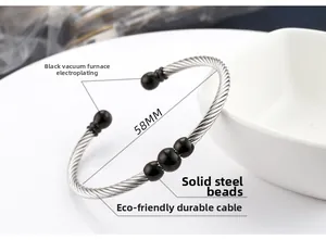 Detailed view of 58mm silver cable bangle with three black vacuum-plated steel beads