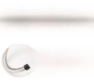 Macro detail of twisted titanium steel cable bracelet with mirror polished finish