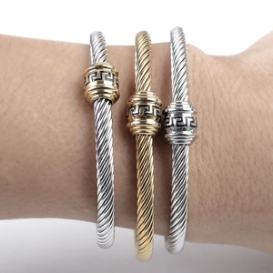 Three-piece stainless steel cable bracelets set with Greek key pattern beads
