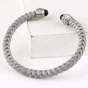 Twisted stainless steel cable cuff bracelet with black bead ends in silver finish
