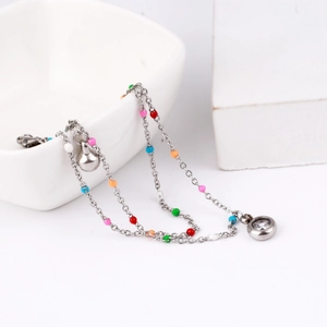 Double-layer silver ankle chain with colorful beads, bell charm, and zircon stone