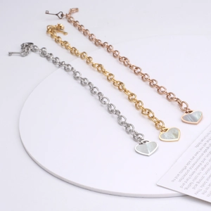 Three-color shell heart and key charm bracelets in gold, silver, and rose gold finish