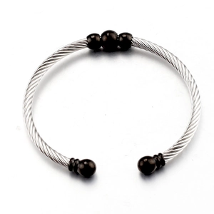 Silver stainless steel cable twisted cuff bracelet featuring five decorative black beads