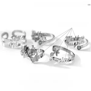 Customized stainless steel open rings featuring engraved names and butterfly motifs