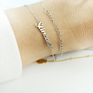 Custom silver stainless steel nameplate bracelet with Strong pendant on wrist