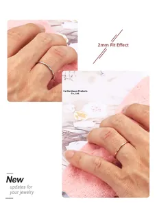 Detail of 2mm minimalist stainless steel rings in silver and rose gold finishes
