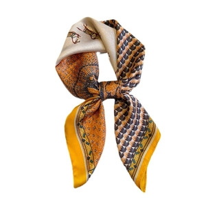 Silk-like square scarf featuring horse prints and houndstooth pattern in orange and cream