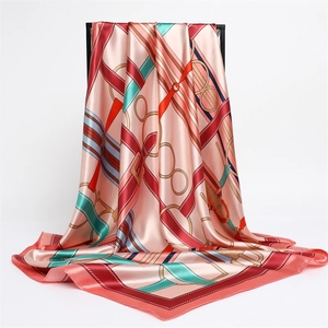 Detail view of vintage satin silk scarf with equestrian chain print and elegant red border