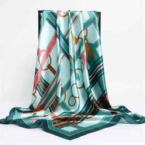 Teal satin square scarf with equestrian patterns featuring belts and chain print