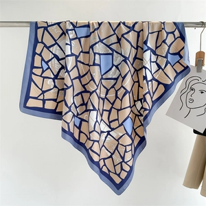 Detail of 90cm square silk scarf featuring abstract geometric mosaic print in blue and beige