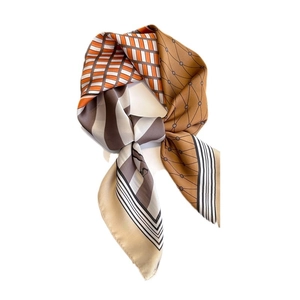 Colorful printed silk scarf featuring orange geometric patterns and brown polka dots