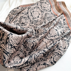 Detail of baroque vine patterns and Greek fret border on high-quality silk scarf