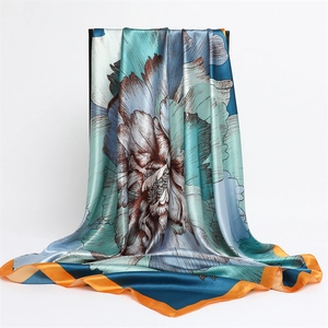 Elegant gradient floral silk scarf featuring 90cm square satin design with orange hem