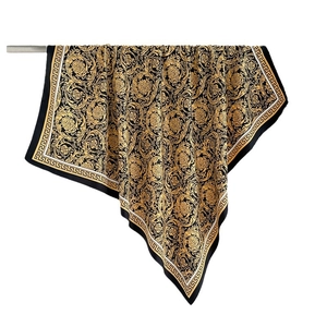 Luxurious black and gold silk square scarf featuring baroque floral prints and greek fret border