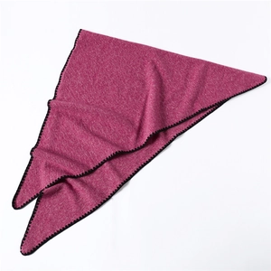 Detail of rose pink triangle scarf showing woven texture and black crochet edge finish