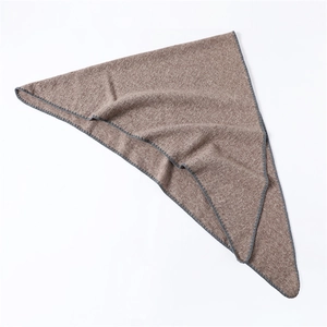 Detailed view of brown triangle scarf showing grey overcast stitching and knit texture