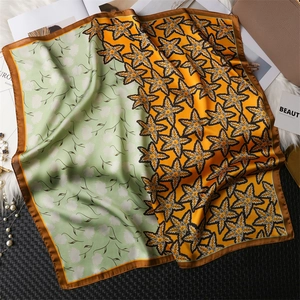 Fashionable square silk scarf with orange maple leaf print and green floral pattern