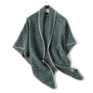Thick dark green cashmere-like shawl with cream crocheted edges and a soft knit texture