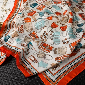 Detail of vintage French square scarf showing 100% polyester fabric and luxury bag patterns
