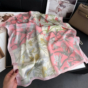 Detail of pink and cream iris flower silk scarf with contrast color blocking and piping