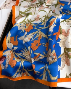 Detailed view of silky iris floral square scarf showing soft texture and vibrant colors