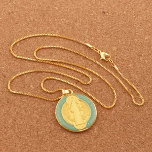 Saint Benedict religious medal necklace in gold finish with dark green enamel detail