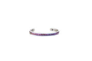 Macro shot of stainless steel C-shaped cuff bracelet with rainbow chain and magnets