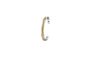 Detail of silver and gold bicolor stainless steel open cuff with magnet ends