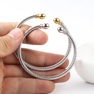 Twisted cable C-shape stainless steel bracelet with 18k gold plated ball ends