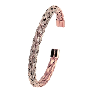 Macro detail of rose gold braided stainless steel wire bracelet with smooth cylinder ends