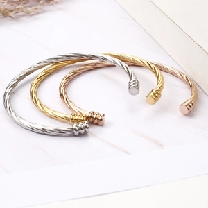 Three-piece twisted titanium steel open bangles in gold, silver, and rose gold finish