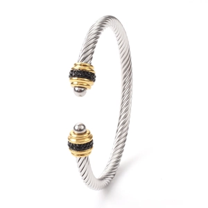Twisted cable stainless steel cuff bracelet with gold accents and black stones