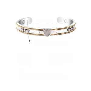 Detail view of magnetic stainless steel heart bracelet with sliding crystal beads