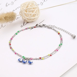 Detailed shot of silver evil eye anklet with colorful beads and adjustable lobster clasp