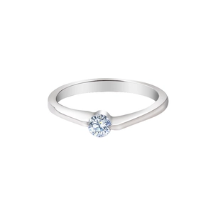 Macro detail of silver ring with white zircon stone and stylish crisscross twist setting
