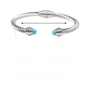 Detail of twisted stainless steel cable bangle with blue agate beads on 62mm open ends